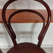 pair of round bistro chairs with a pattern on the seat, vintage