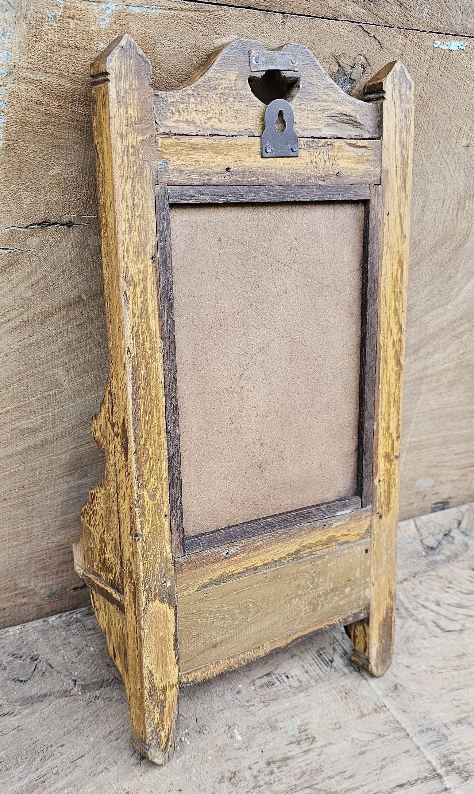 Antique barber's mirror in Burmese teak.