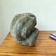 Stone sculpture of a man