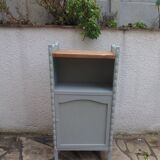 Vintage furniture of shallow depth re-enchanted in grey-green.