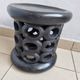 Bamiléké black stool in carved wood with rings – 33 × 35 cm