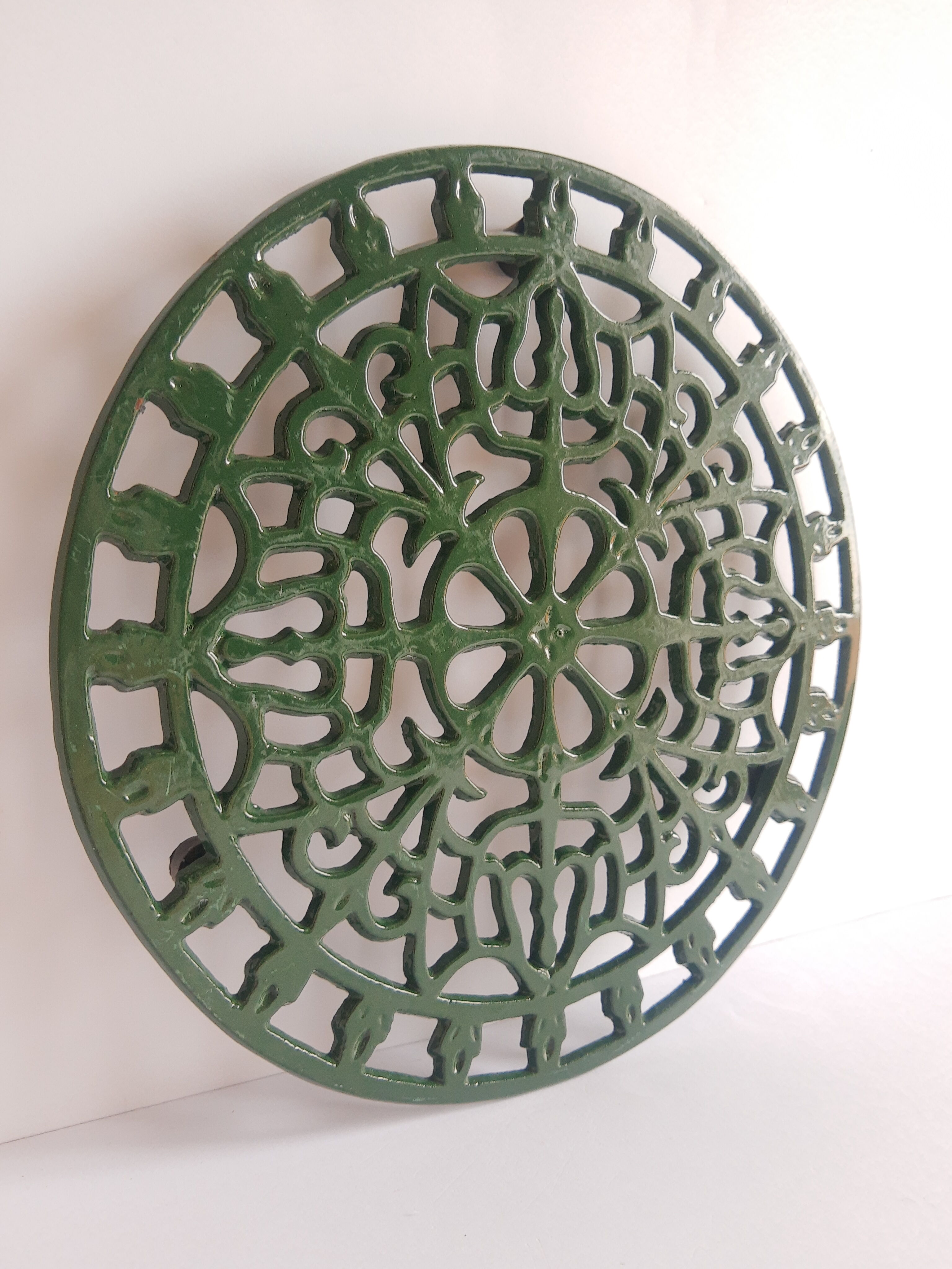 Vintage green cast iron trivet