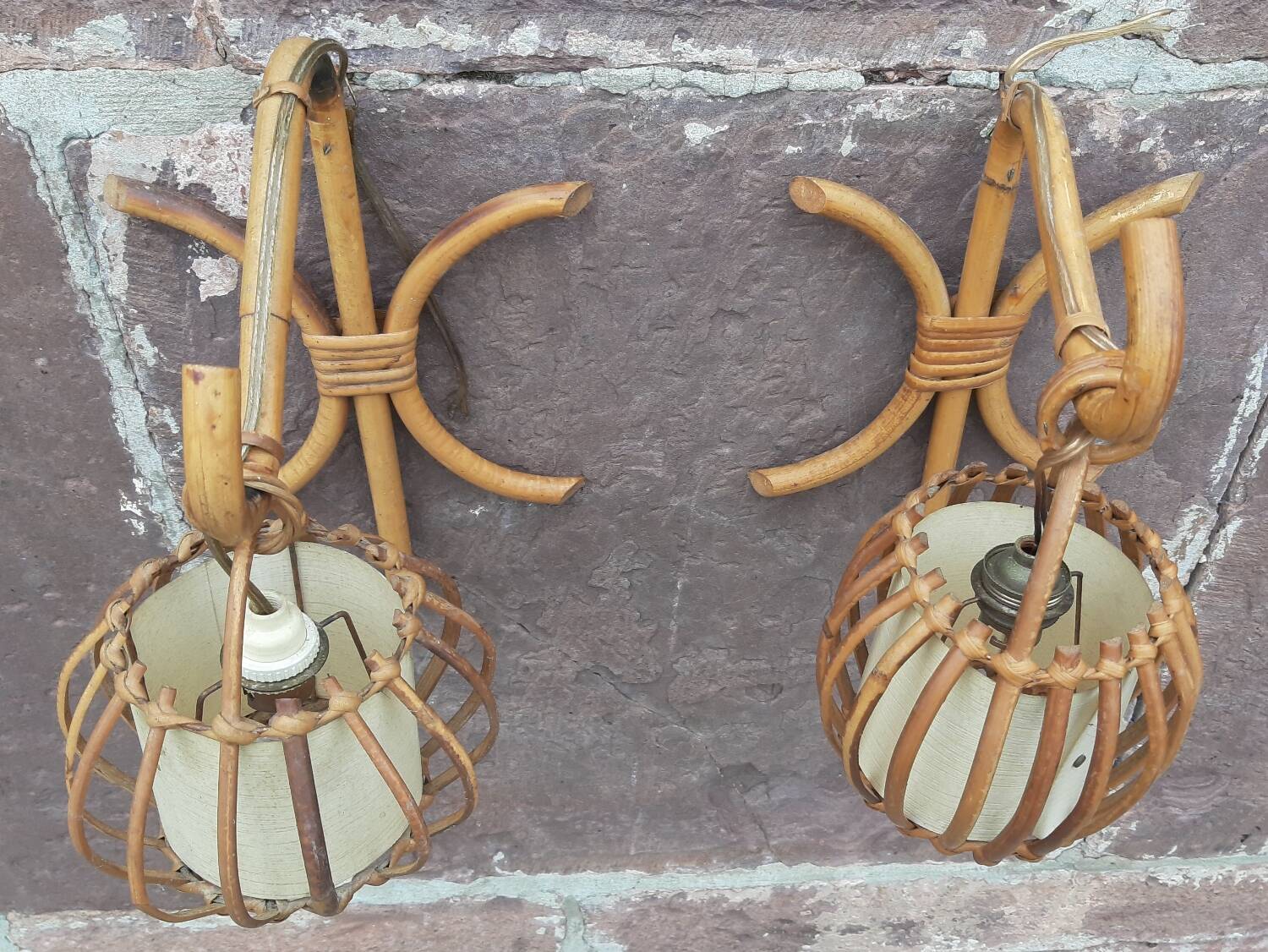 Pair of Louis Sognot rattan wall lights.