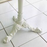 Round marble table with central cast iron leg