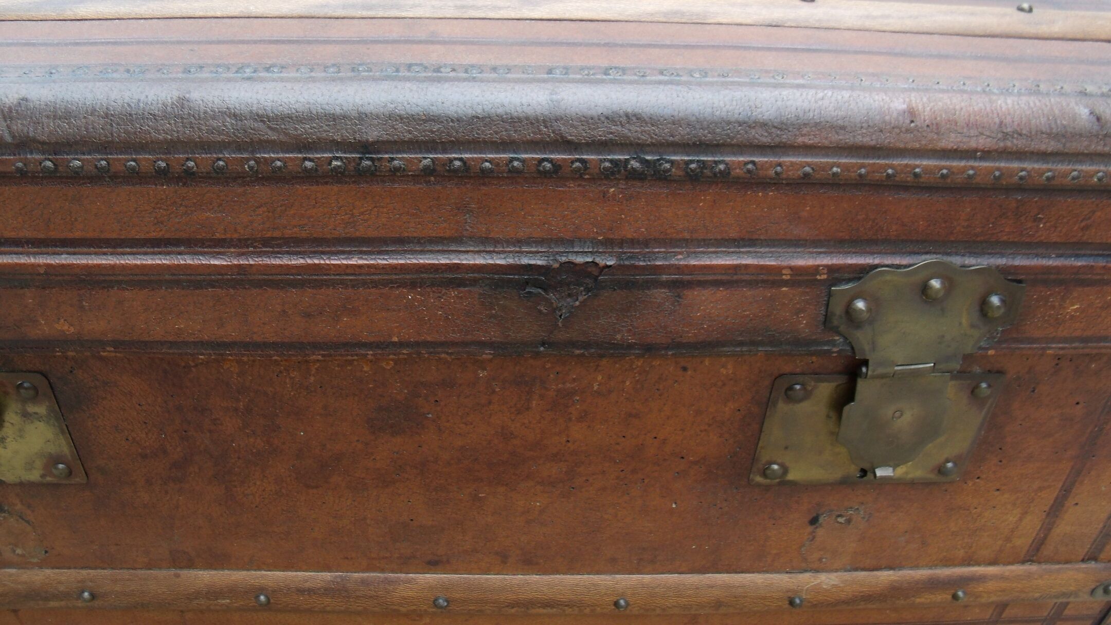 Old wooden trunk covered leather travel chest