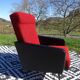 Vintage armchairs in red and black faux leather, the pair.