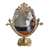 Swivelling brass mirror