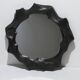 Sculptural sandstone mirror