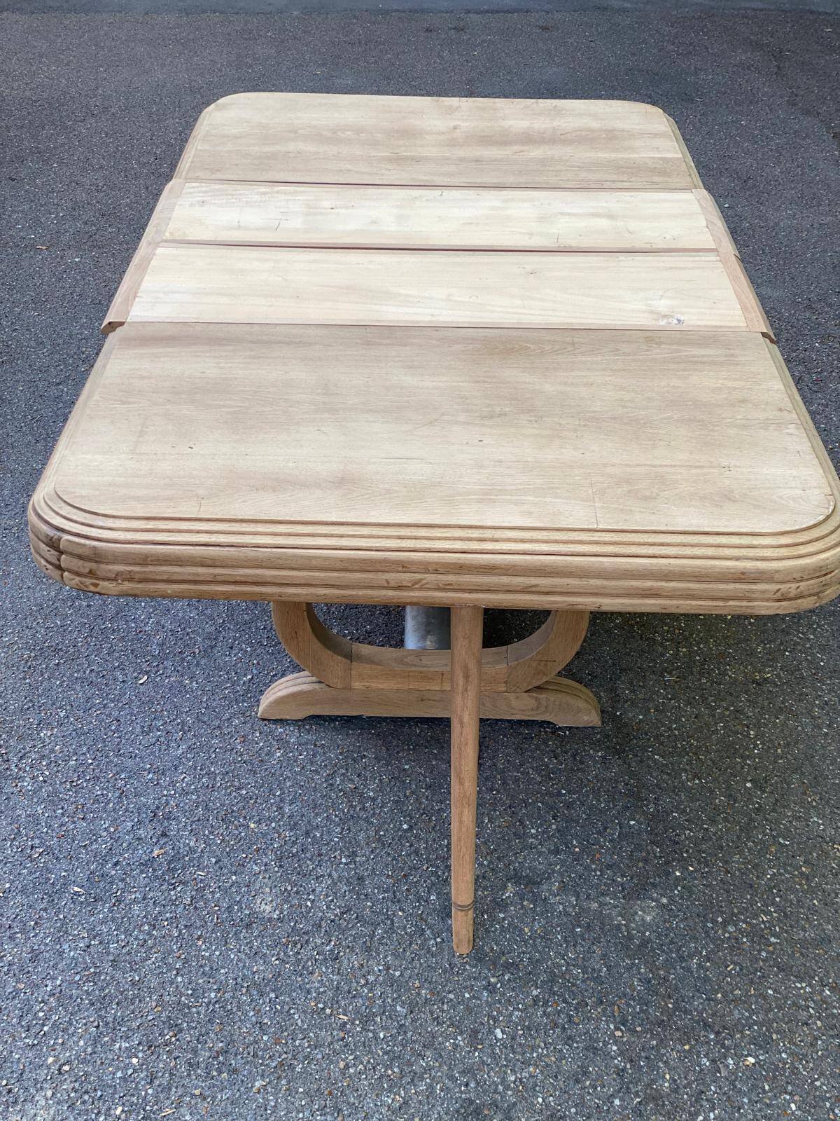Art Deco dining table with a central pedestal, stripped in solid oak, with 2 extensions.