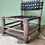 Vintage armchair in woven leather and wood