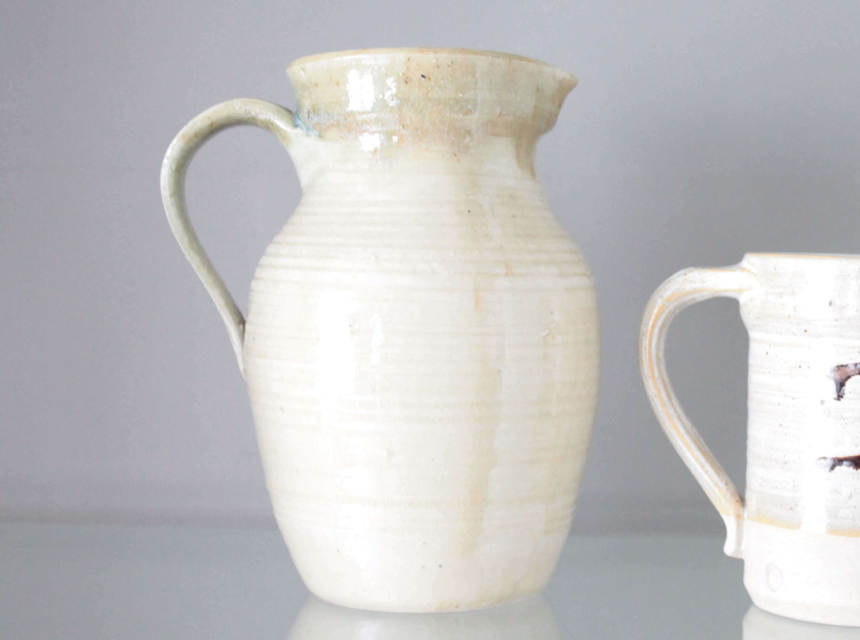 Old decanter in enamelled sandstone