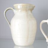 Old decanter in enamelled sandstone