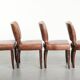 Set of 4 cognac-coloured cowleather dining chairs with decorative nails