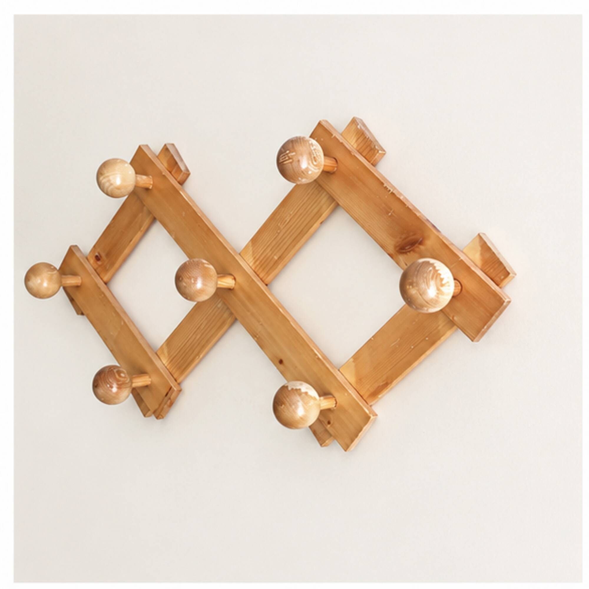 Extendable wall coat rack in light wood, 1980s.
