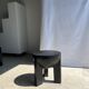 Black mango wood tripod side table with a semi-spherical top, height: 45 cm, diameter: 44 cm.
