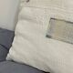 Coussin carré en toile ancienne style kilim tissé, patché, monogramme AB