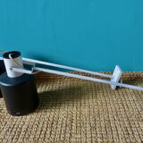 Pair of long white arm wall lights with black spot. "lita device"