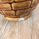 Vintage Sarreguemines pitcher with brown relief decoration.