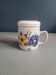 Vintage tea cup with filter and lid