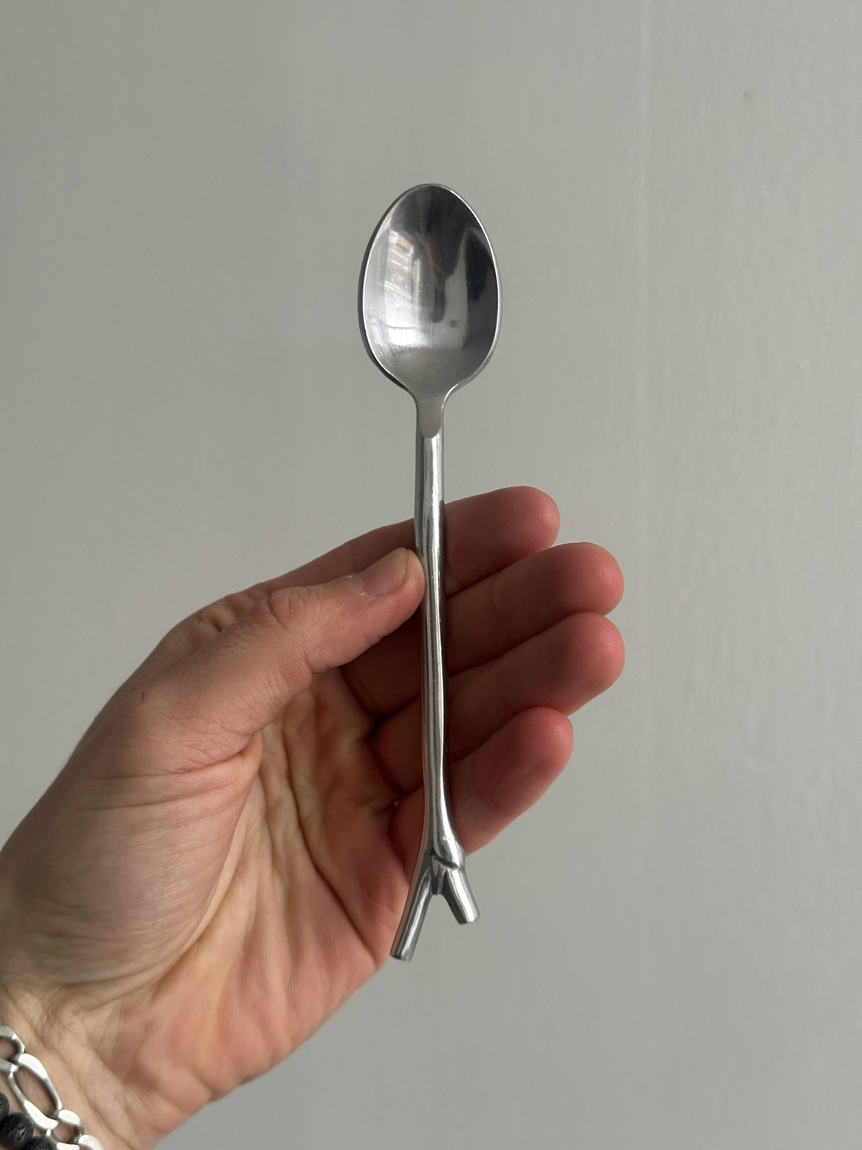 5 small silver metal spoons