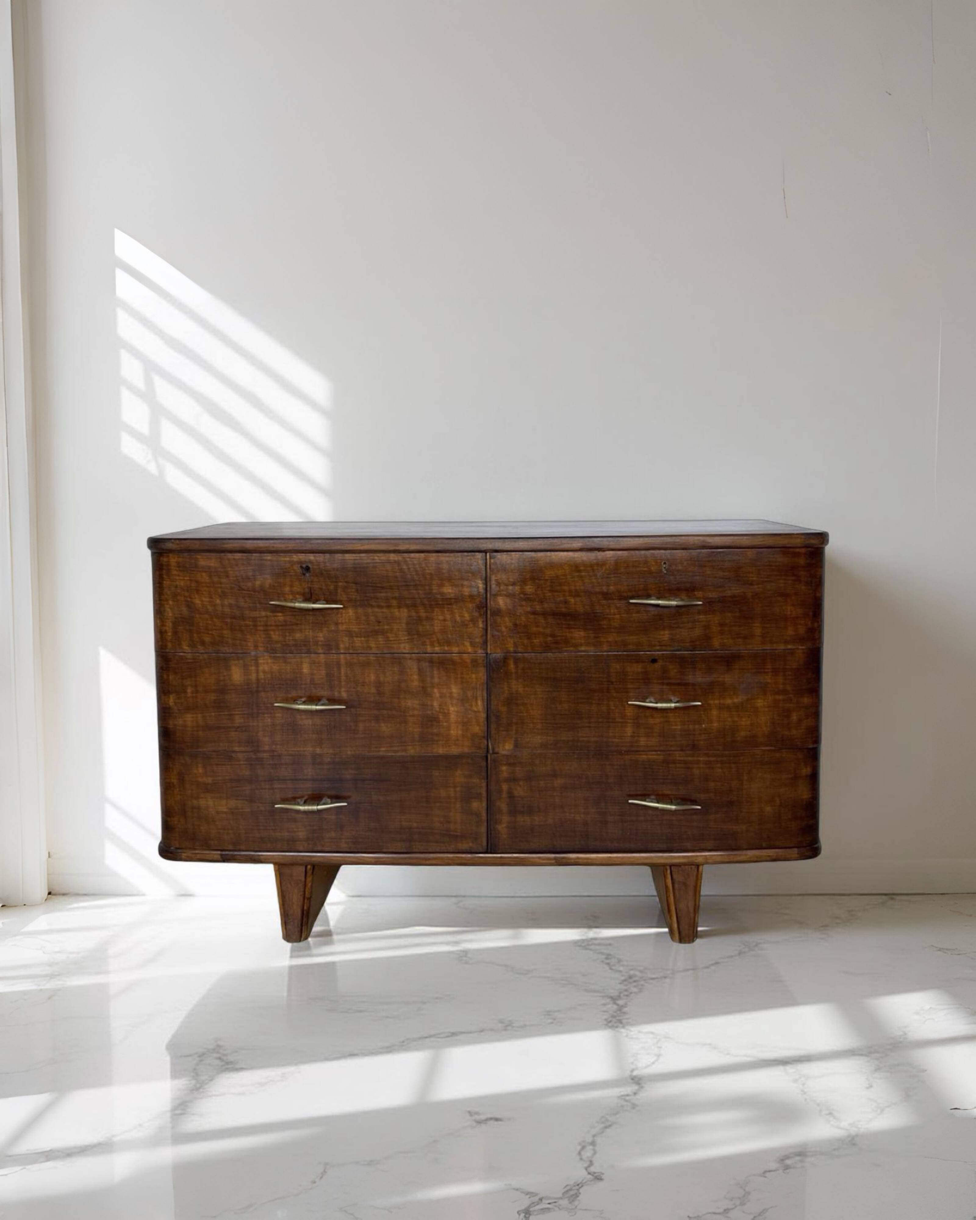 A vintage Italian chest of drawers, made of veneered walnut and solid wood,