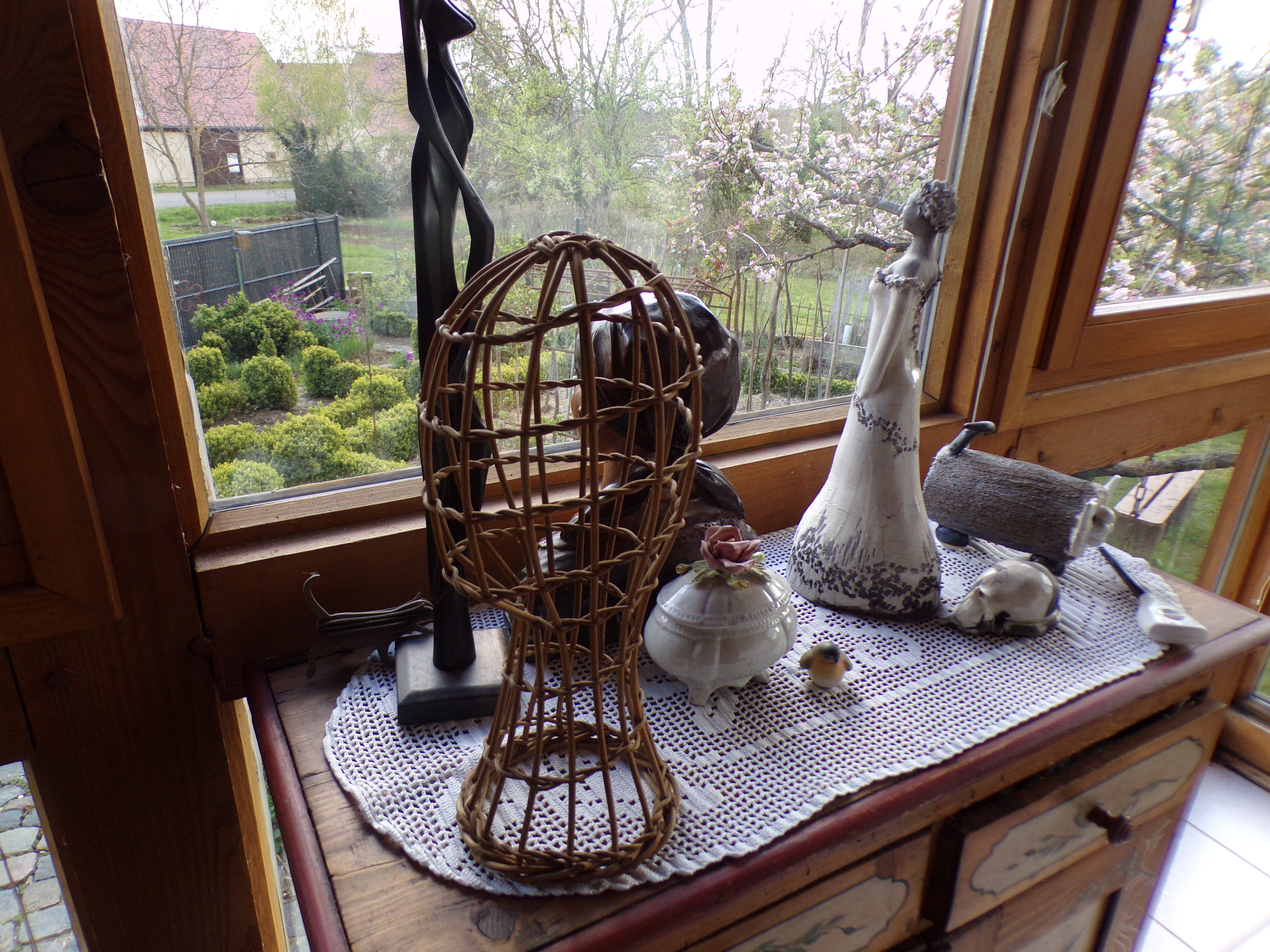 Old bust head in wicker