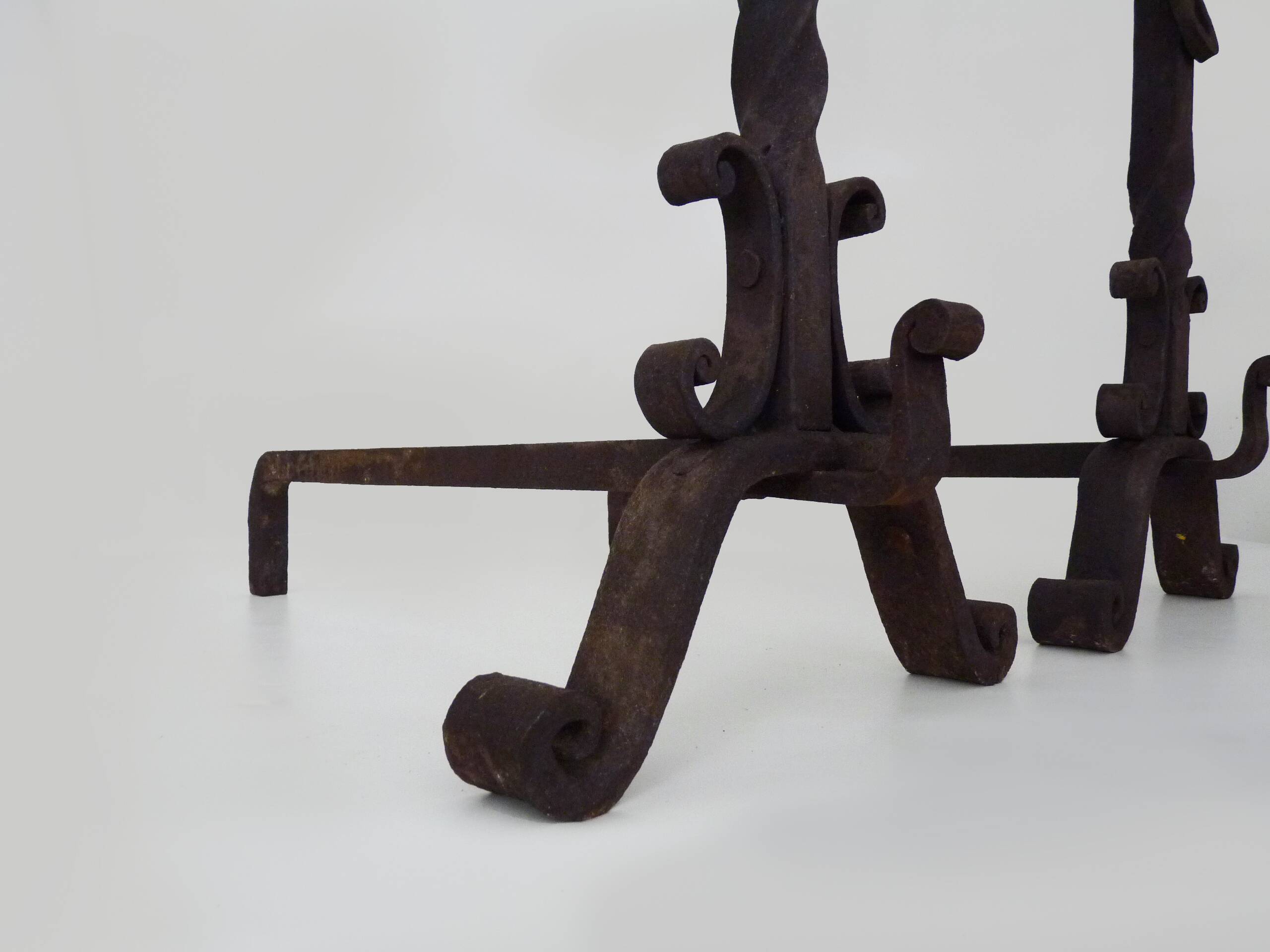Pair of wrought iron andirons with 19th century fireplace set