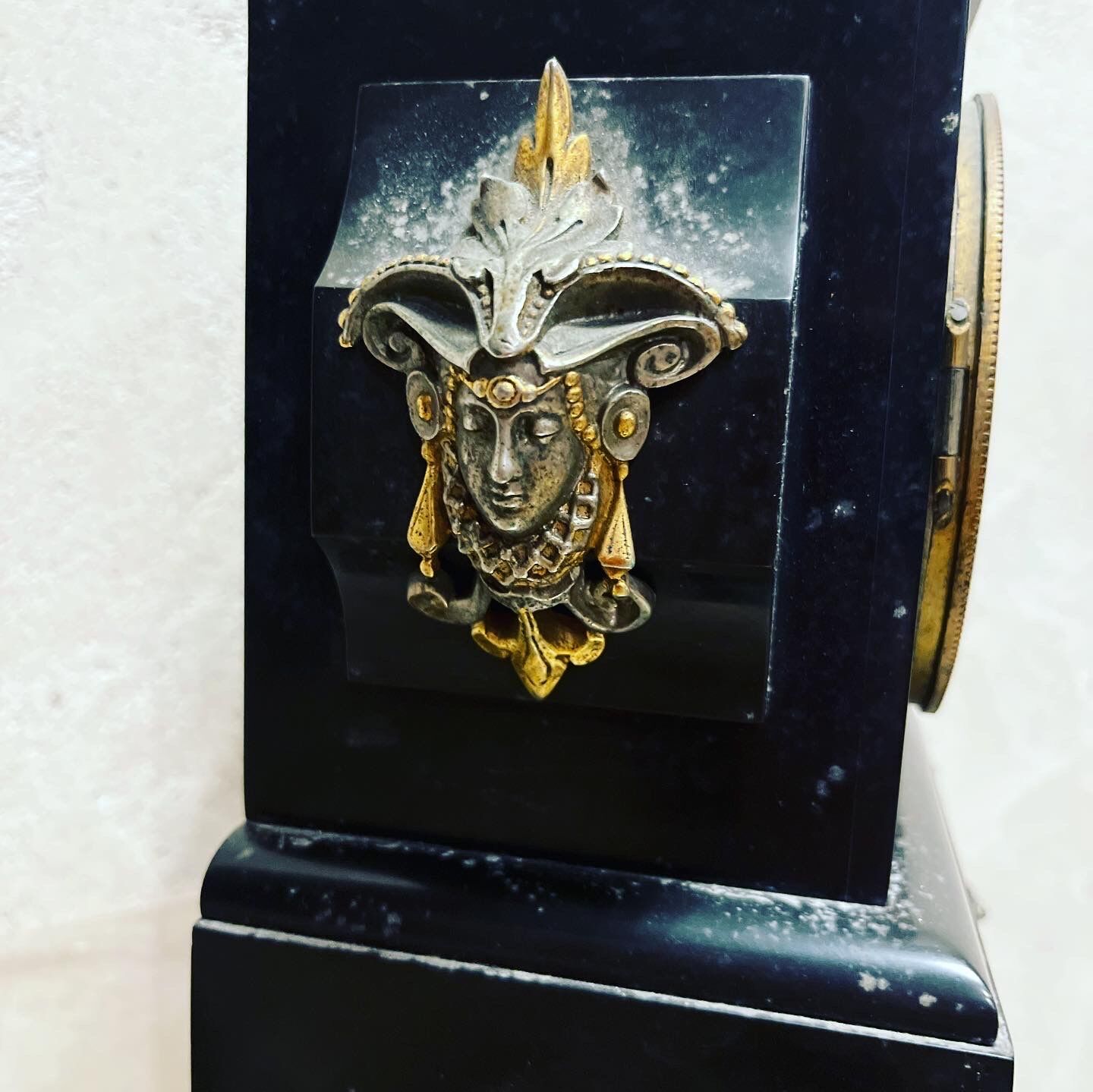 Black marble clock and brass ornament