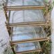 Set of nesting brass and glass serving trolleys