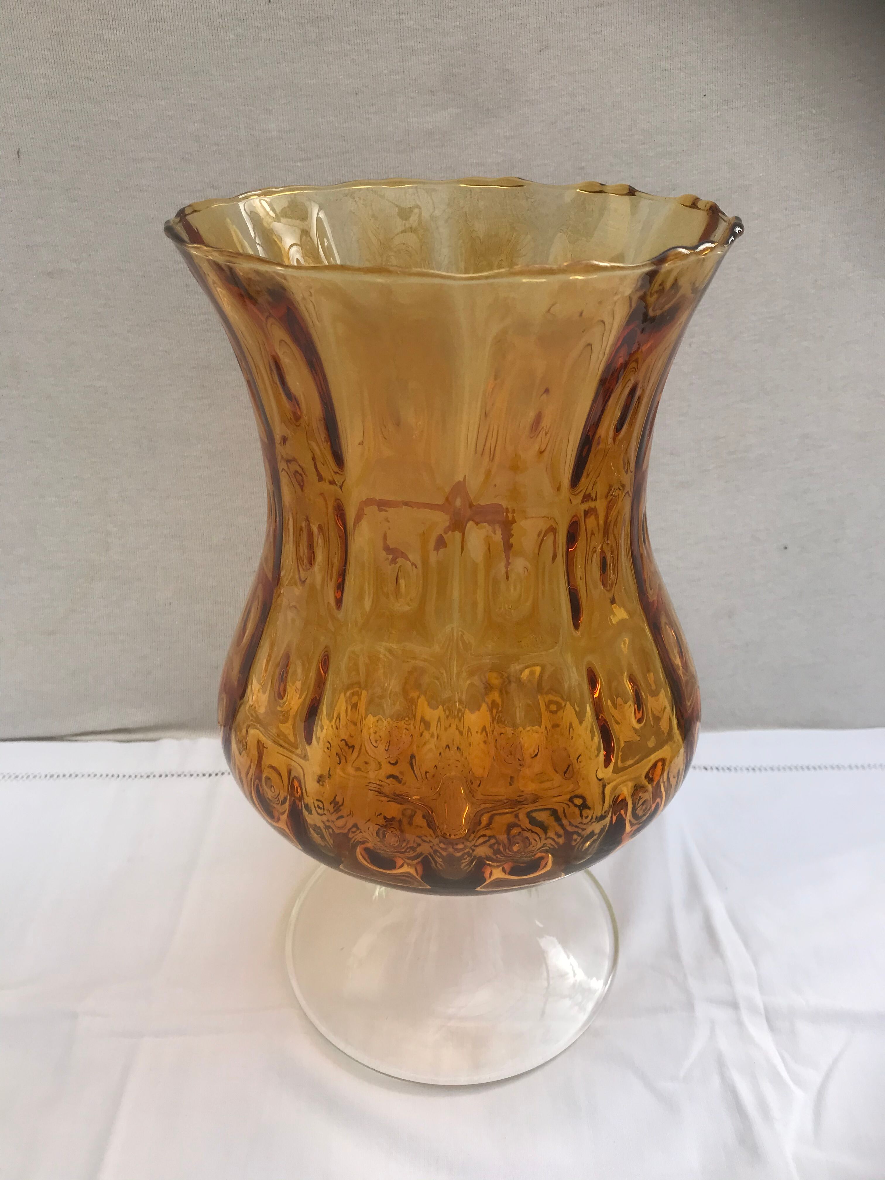Ancient vase on foot orange glass