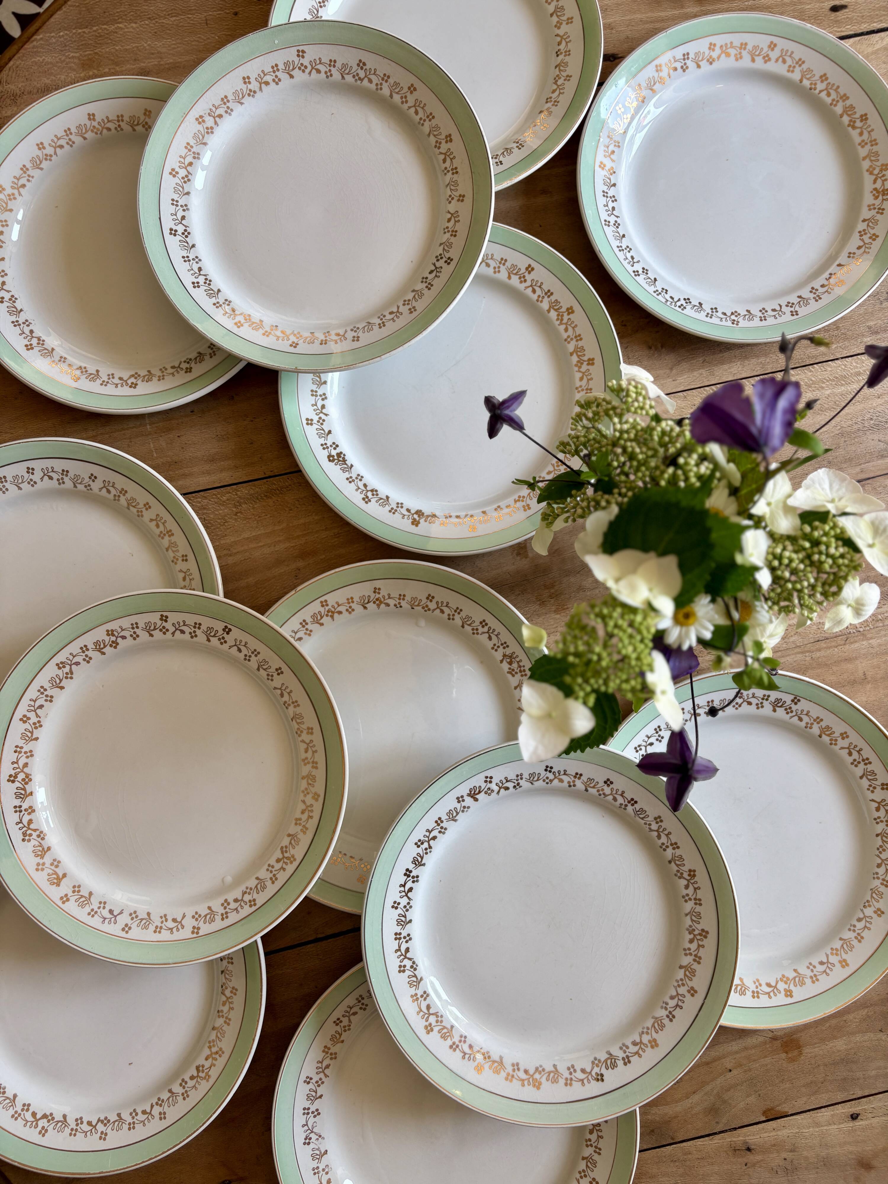 Set of 12 white, mint and gold flat plates, Mosèle de Lunéville