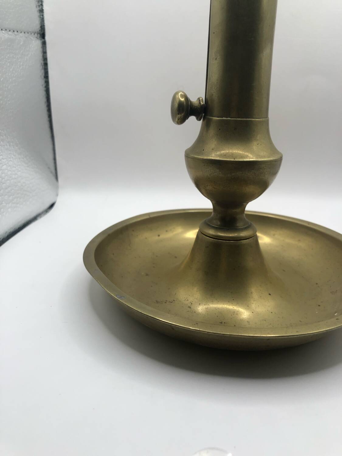 Candle holder with a pusher