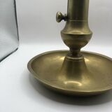 Candle holder with a pusher