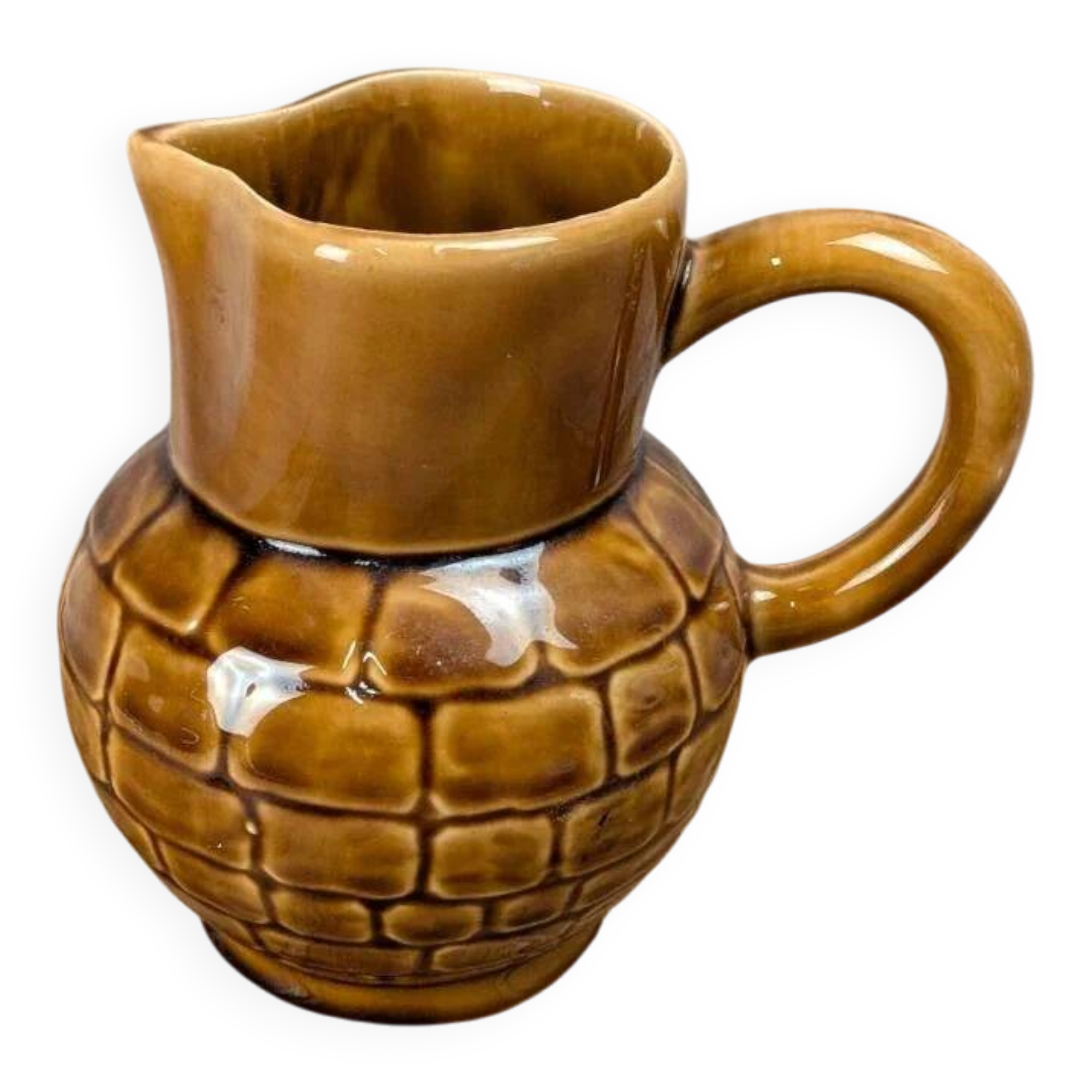 Vintage Sarreguemines pitcher with brown relief decoration.