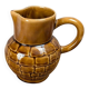 Vintage Sarreguemines pitcher with brown relief decoration.
