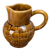 Vintage Sarreguemines pitcher with brown relief decoration.