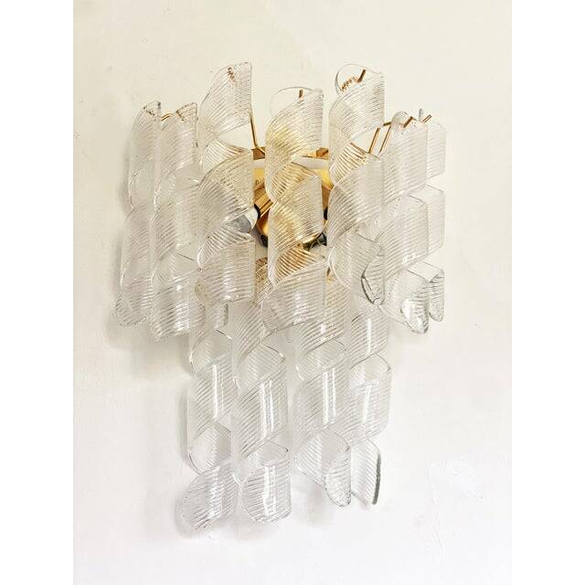 A pair of contemporary transparent “ricci” murano glass wall sconces