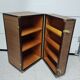 Wardrobe trunk on casters in mahogany and woven rattan.