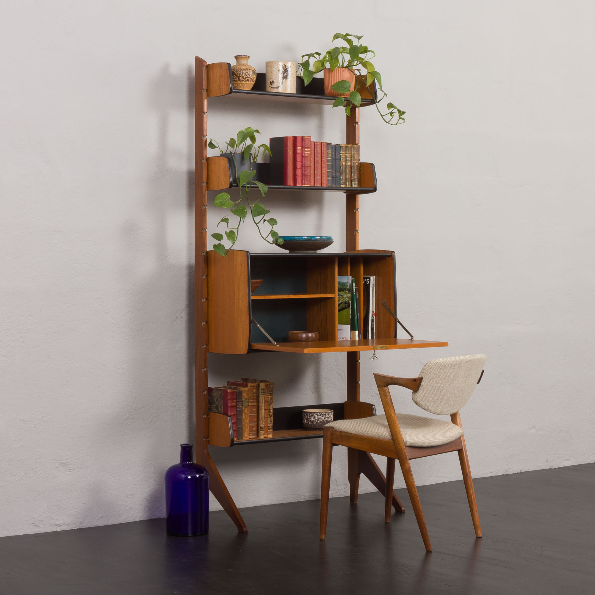 Scandinavian free standing vertical bookcase with a secrtetaire or home office wall unit model Ergo,