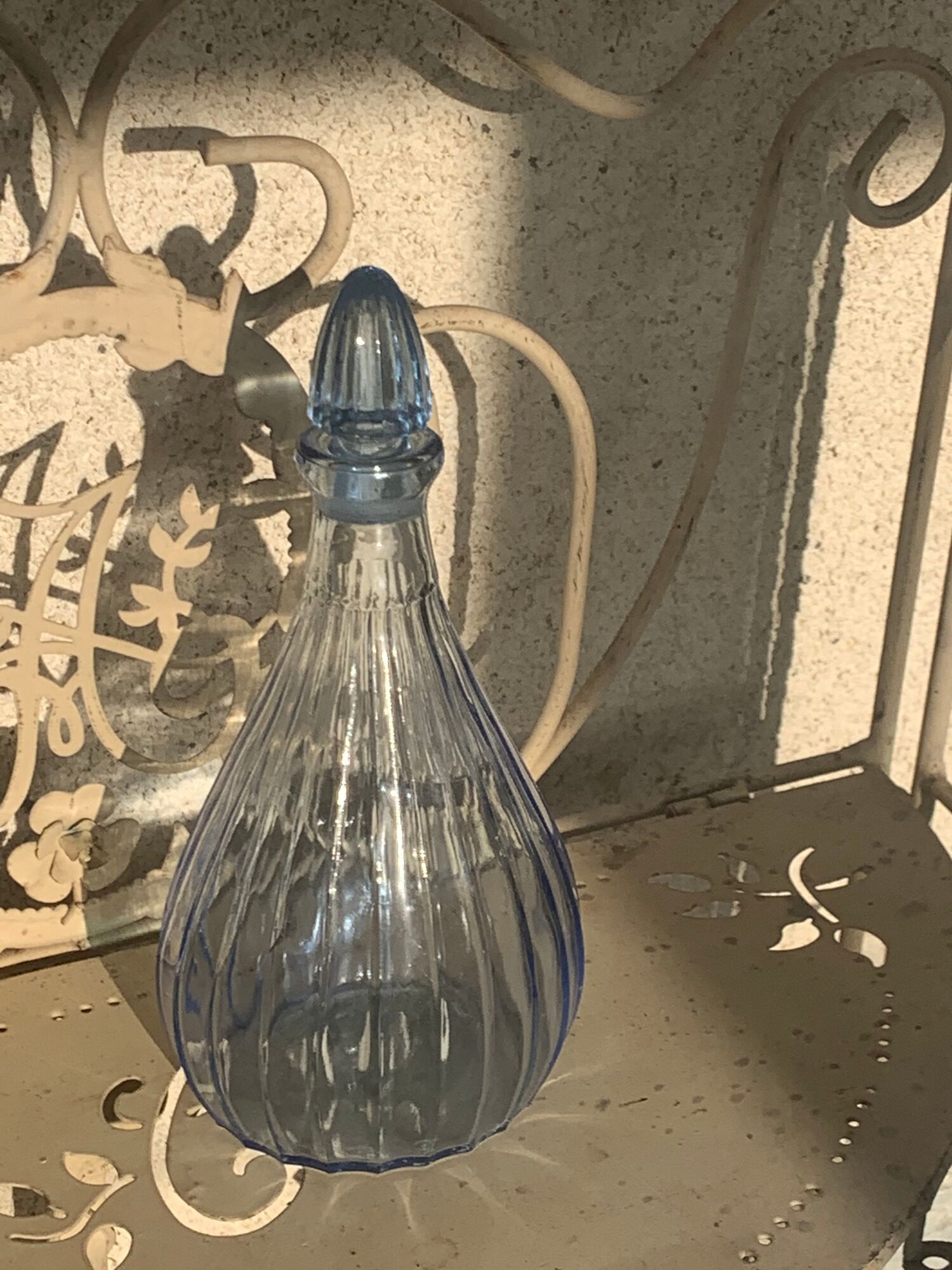 Liquor service consisting of a blue glass decanter and. 3 small antique glasses