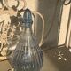 Liquor service consisting of a blue glass decanter and. 3 small antique glasses
