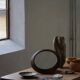 Round wooden wall decorative mirror, carved frame, mid-20th century, 1950s.
