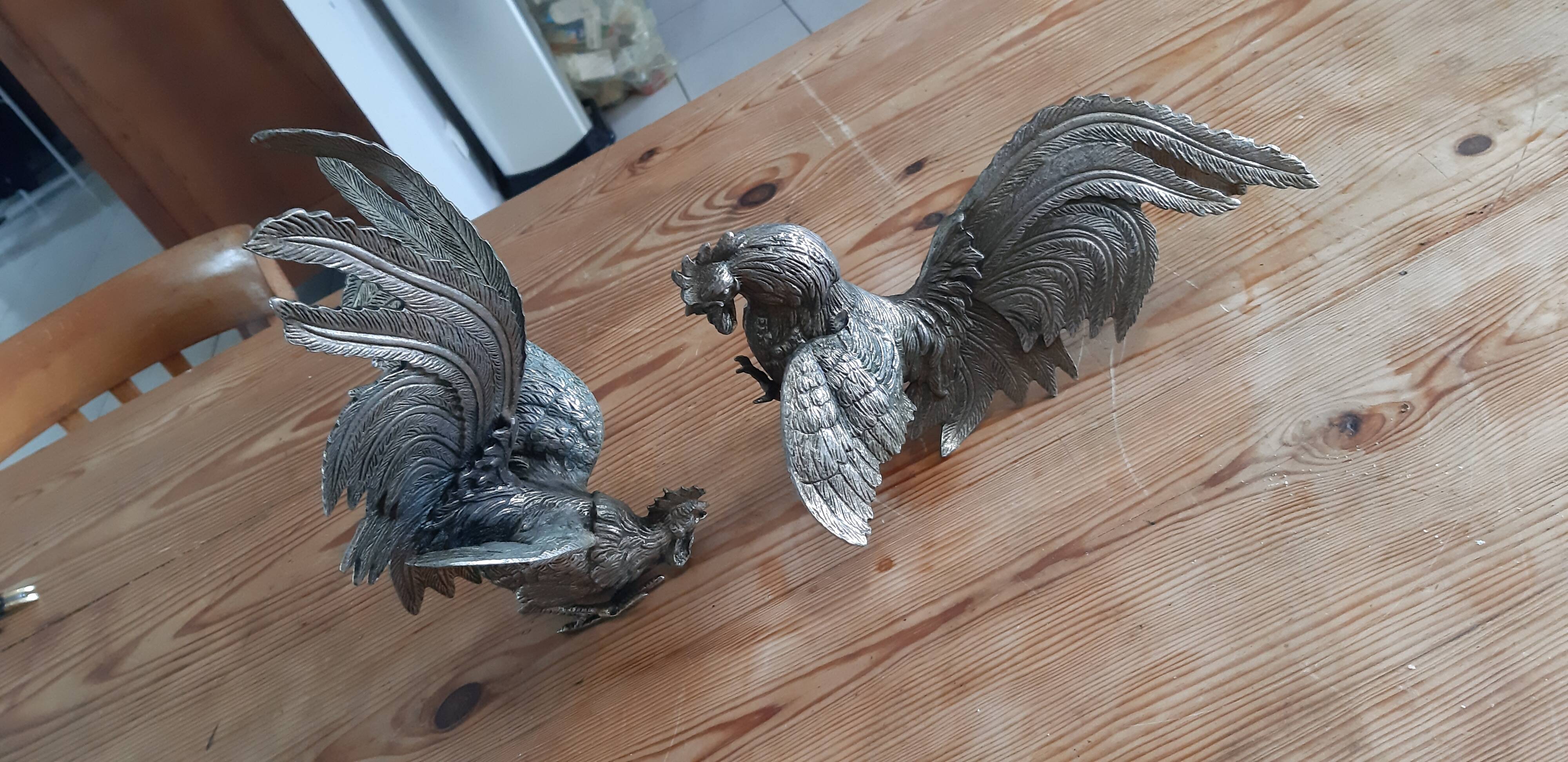 2 silver metal roosters