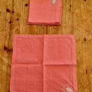 Set of 4 embroidered pink napkins.