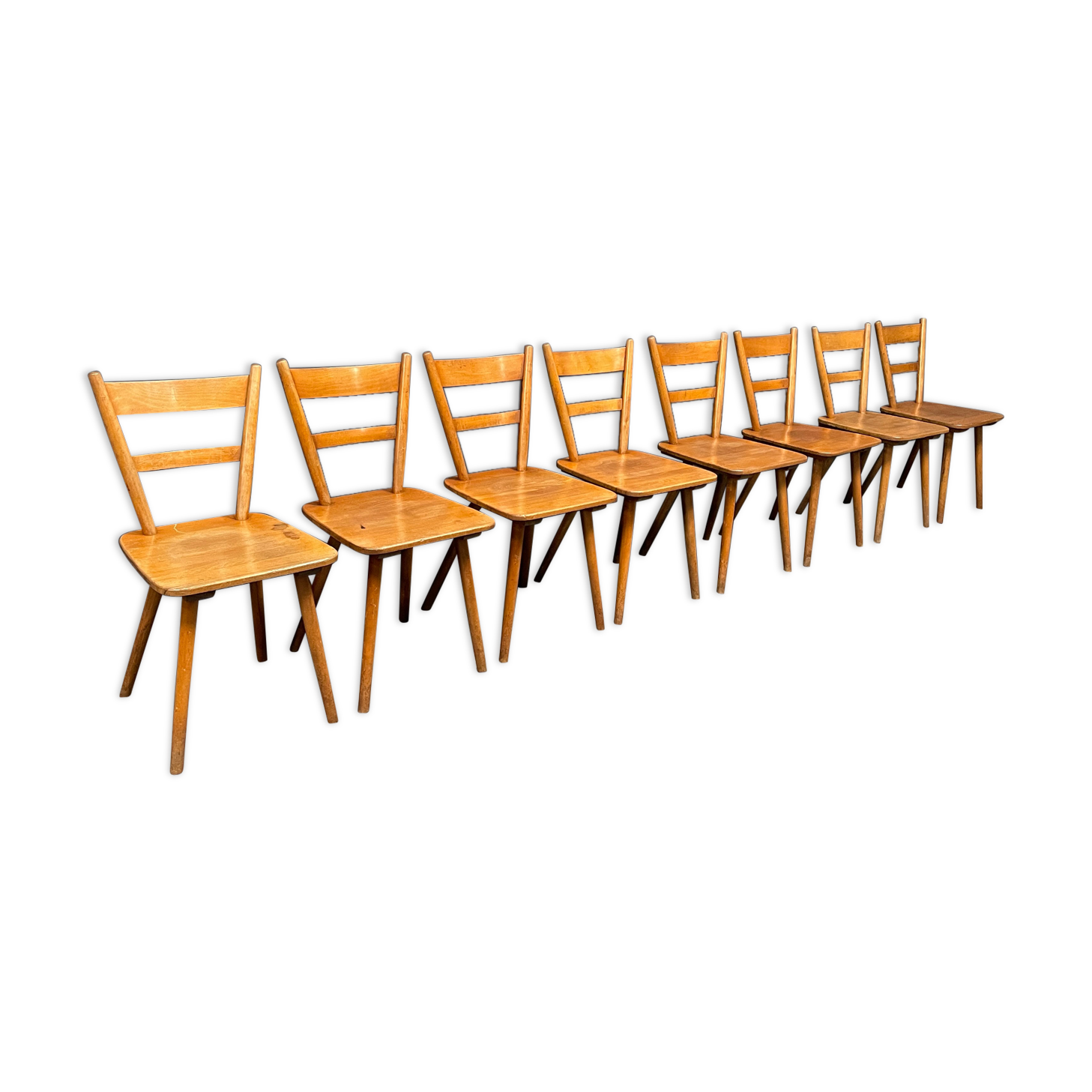 Set of eight german stick chairs from the 1950