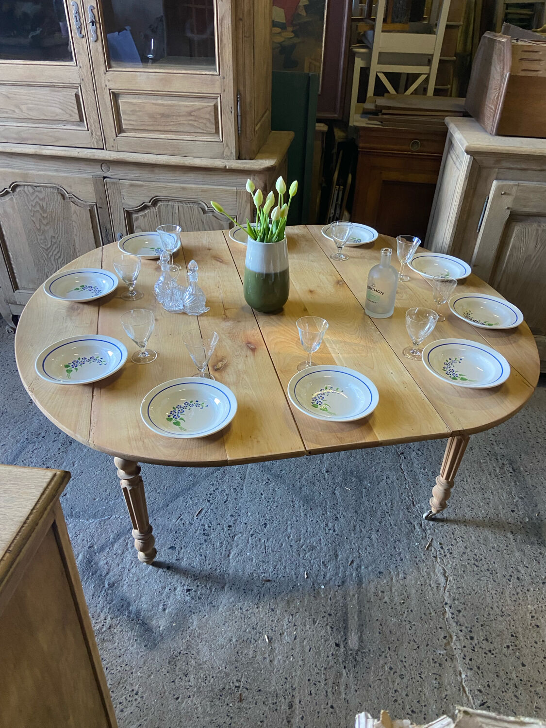 Oval wooden table on wheels.
