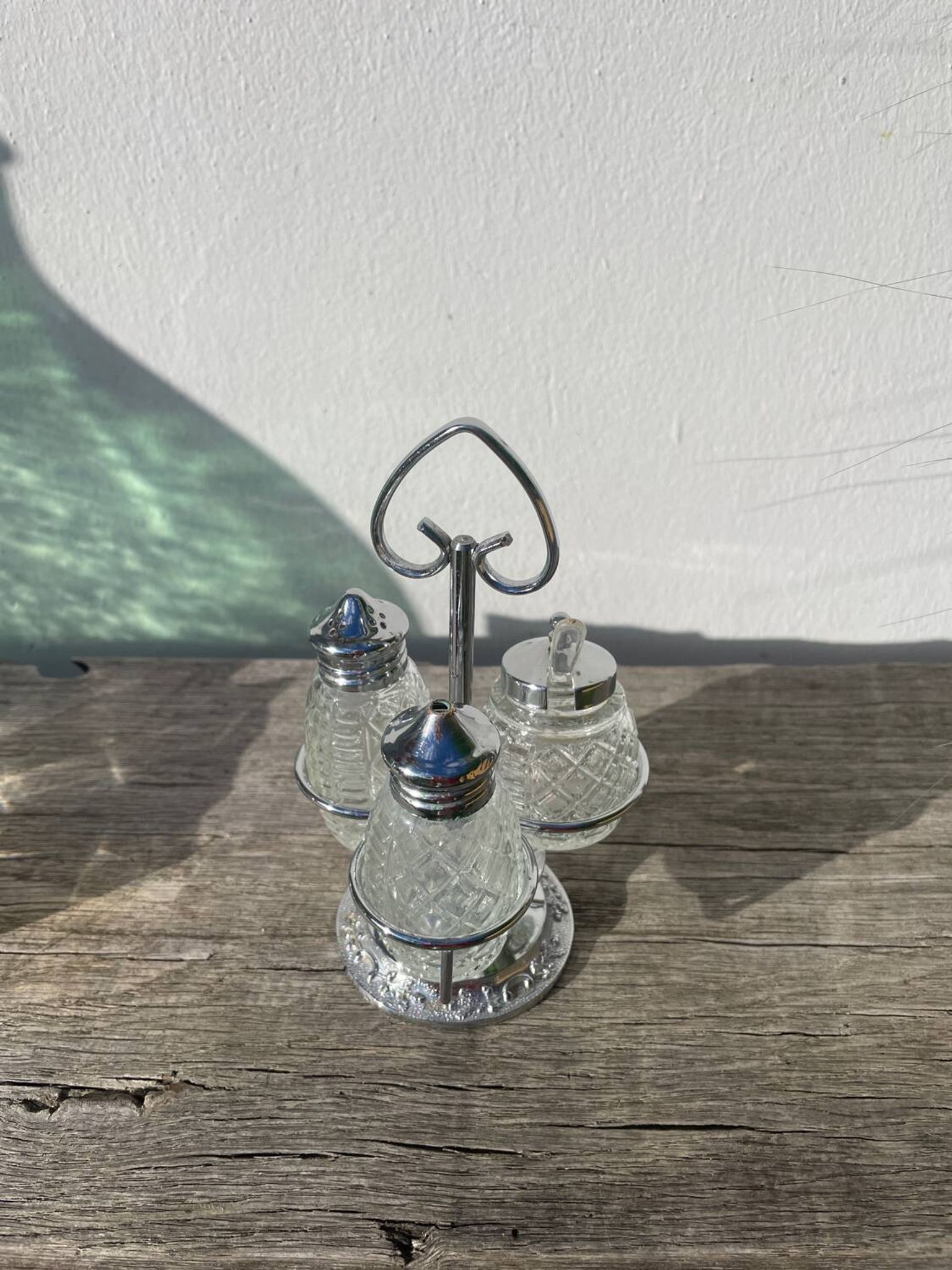 Silver-plated metal and glass salt and pepper shakers
