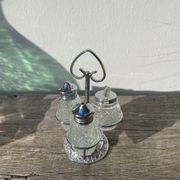 Silver-plated metal and glass salt and pepper shakers