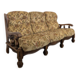 Rustic solid oak sofa with floral decoration
