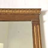 Small golden mirror in Louis XVI style.